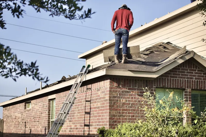 Professional roofer working on a residential roof in Narberth